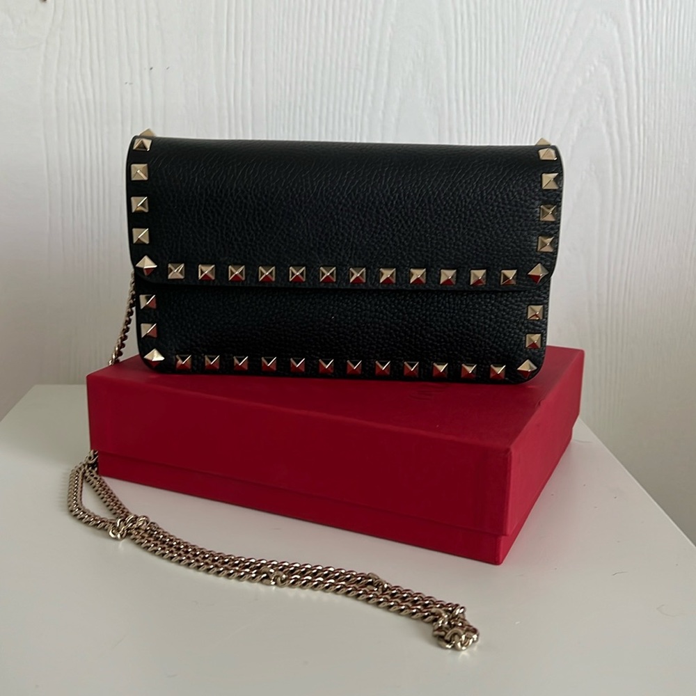 Valentino Rockstud leather clutch on chain